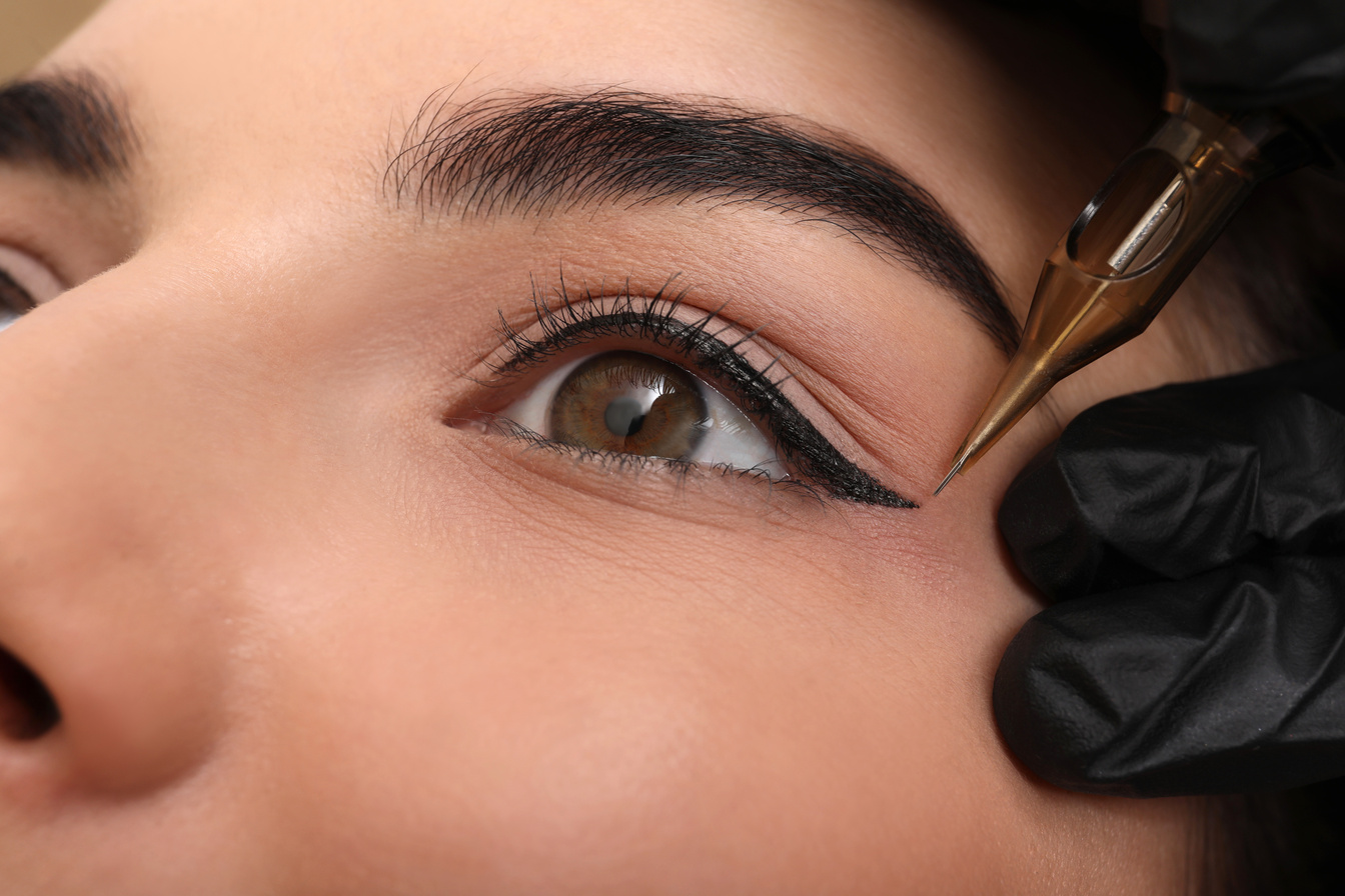 Young Woman Undergoing Procedure of Permanent Eye Makeup in Tatt